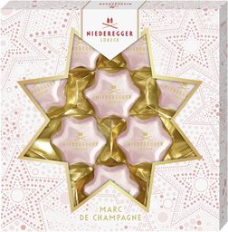 NIEDEREGGER christmas pralinen sterne marc de champagne in weisser schokolad 125g